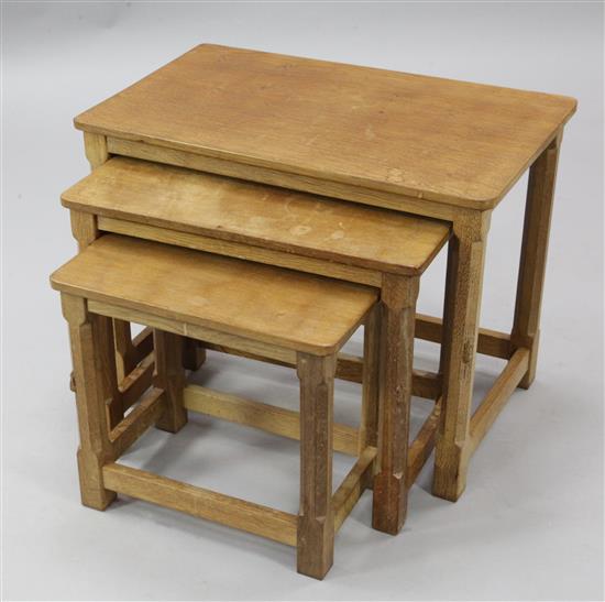 A nest of three Robert Mouseman Thompson oak occasional tables, largest W.2ft D.1ft 3in. H.1ft 7in.